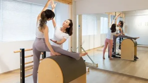 pilates exercise on ladder barrel ballet stretch